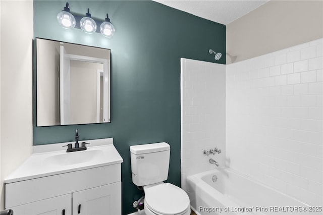 full bathroom with shower / bathing tub combination, vanity, a textured ceiling, and toilet