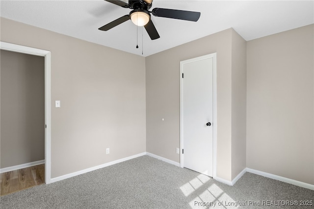 unfurnished bedroom featuring light carpet and ceiling fan