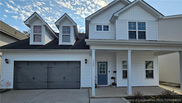 view of front facade featuring a garage and a porch