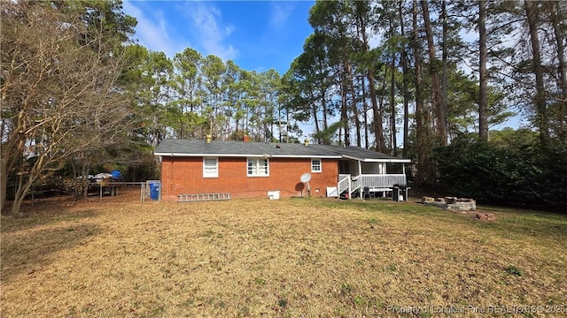 back of house with a yard