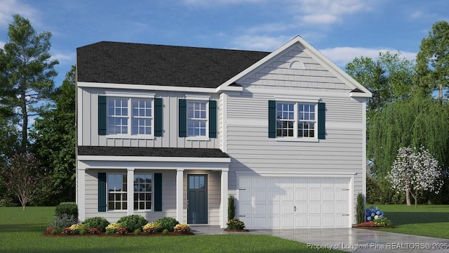 view of front of property with a front lawn and a garage