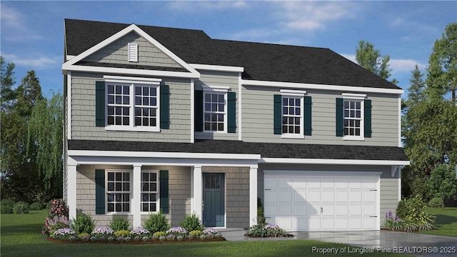 view of front facade featuring a garage and a front yard