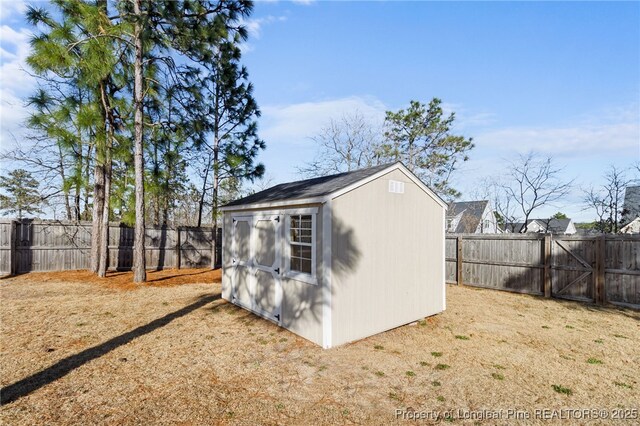 view of shed featuring a fenced backyard