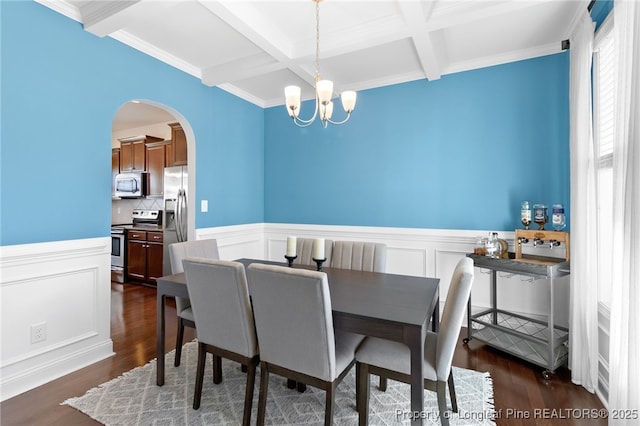 dining space with arched walkways, a chandelier, coffered ceiling, beamed ceiling, and dark wood finished floors