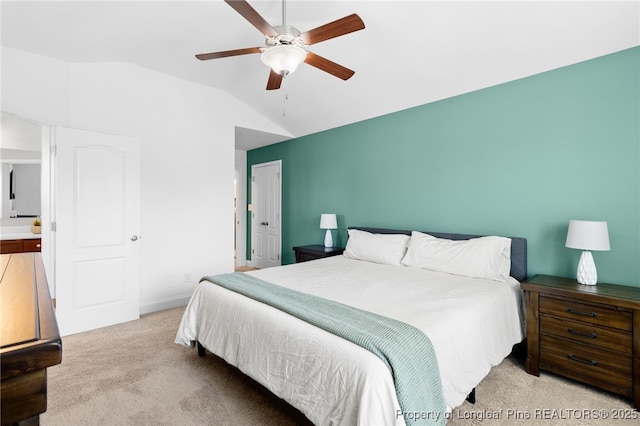 bedroom with vaulted ceiling, ceiling fan, and light colored carpet