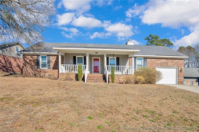 ranch-style home featuring brick siding, a chimney, covered porch, crawl space, and a garage