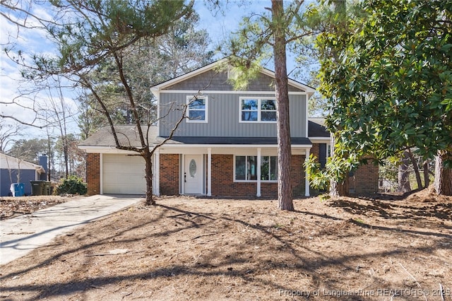 traditional-style home with brick siding, driveway, and an attached garage