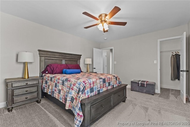 183 Ganton Dr, Raeford, NC 28376 - bedroom featuring a spacious closet, baseboards, carpet, and a ceiling fan