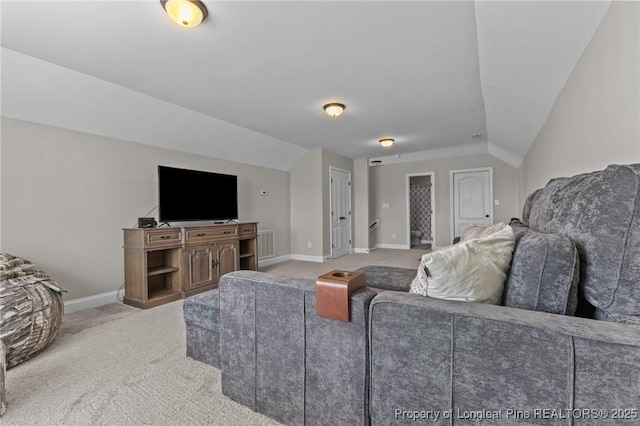 183 Ganton Dr, Raeford, NC 28376 - carpeted living room with vaulted ceiling, baseboards, and visible vents