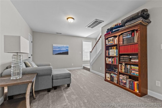 183 Ganton Dr, Raeford, NC 28376 - living area featuring stairs, visible vents, baseboards, and carpet flooring