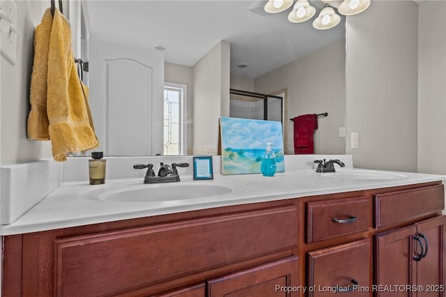 183 Ganton Dr, Raeford, NC 28376 - bathroom with double vanity, a stall shower, and a sink