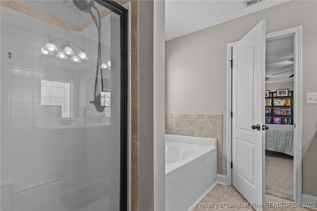 183 Ganton Dr, Raeford, NC 28376 - ensuite bathroom featuring visible vents, ensuite bath, a shower stall, tile patterned flooring, and a bath