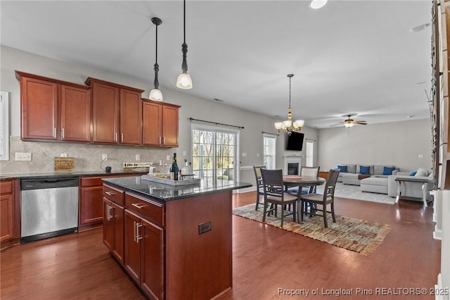 183 Ganton Dr, Raeford, NC 28376 - kitchen featuring dishwasher, decorative backsplash, ceiling fan with notable chandelier, and dark wood-style flooring