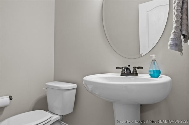 183 Ganton Dr, Raeford, NC 28376 - half bathroom featuring toilet and a sink