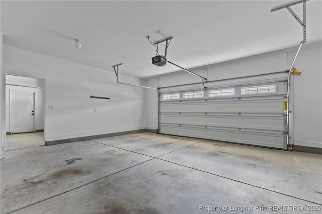 183 Ganton Dr, Raeford, NC 28376 - garage with a garage door opener and baseboards