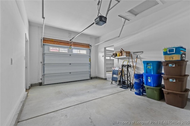 183 Ganton Dr, Raeford, NC 28376 - garage featuring a garage door opener and baseboards