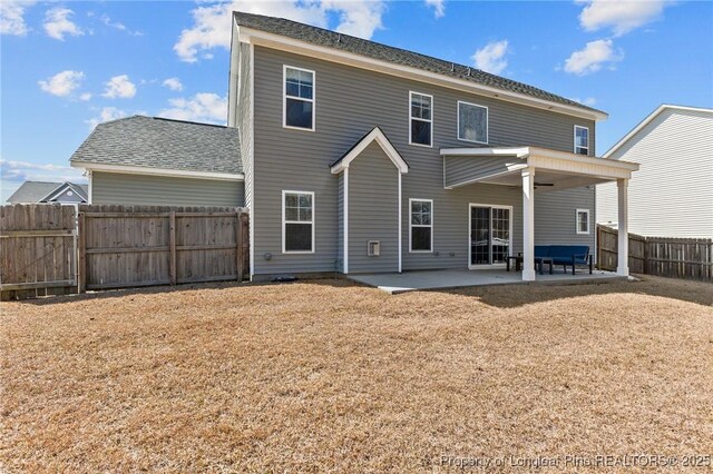 183 Ganton Dr, Raeford, NC 28376 - back of property with a lawn, a patio area, fence, and ceiling fan