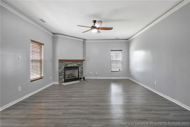 unfurnished living room with ceiling fan, crown molding, a stone fireplace, and visible vents