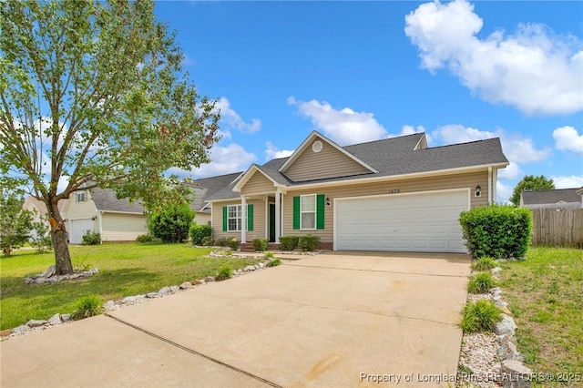 view of front of house featuring an attached garage, driveway, and roof with shingles