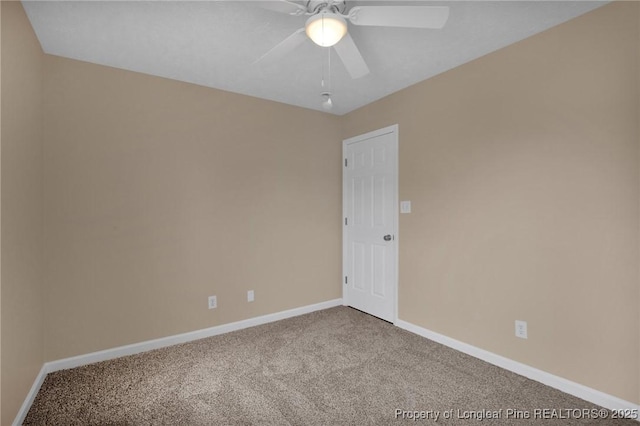 empty room featuring carpet, baseboards, and a ceiling fan