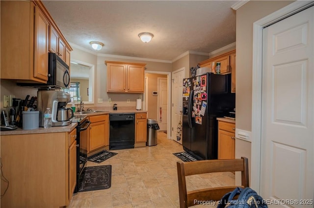 kitchen with crown molding, light countertops, a textured ceiling, a sink, and black appliances