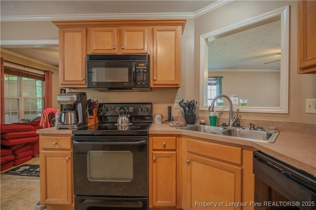 kitchen with crown molding, a sink, black appliances, and light countertops
