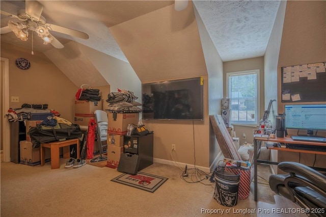 carpeted office with ceiling fan and lofted ceiling