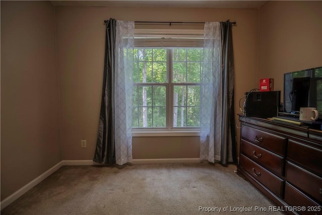 carpeted bedroom with baseboards