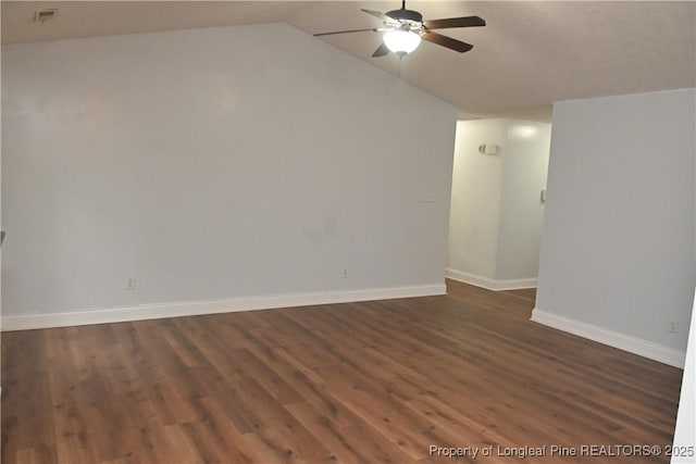 279 Hunters Creek Dr, Raeford, NC 28376 - empty room with a ceiling fan, lofted ceiling, dark wood-style floors, and baseboards