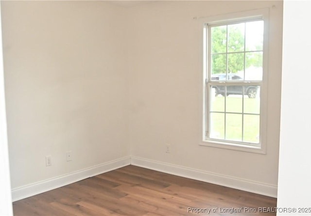 279 Hunters Creek Dr, Raeford, NC 28376 - empty room featuring baseboards and dark wood-style floors