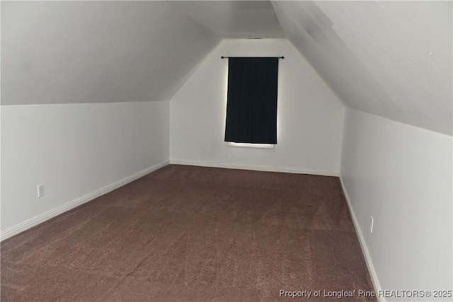 279 Hunters Creek Dr, Raeford, NC 28376 - bonus room with dark carpet, lofted ceiling, and baseboards