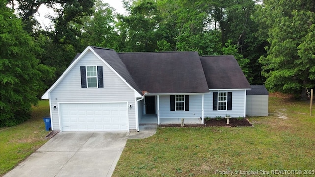 279 Hunters Creek Dr, Raeford, NC 28376 - view of front of home with concrete driveway, a front lawn, covered porch, and an attached garage