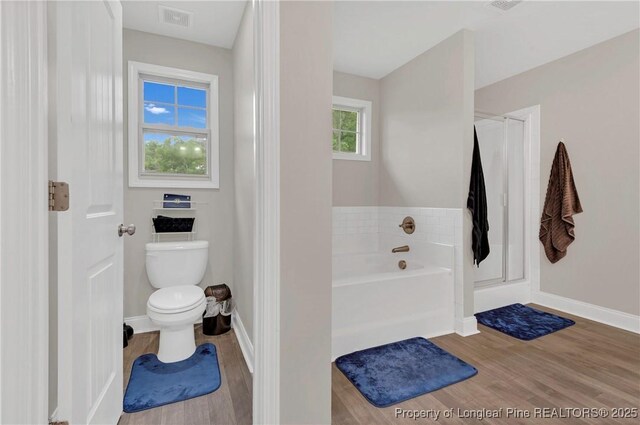 5145 Maxwell Rd, Stedman, NC 28391 - full bath featuring wood finished floors, a garden tub, toilet, and baseboards