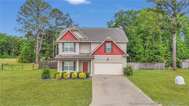 5145 Maxwell Rd, Stedman, NC 28391 - view of front facade featuring a garage, driveway, and roof with shingles