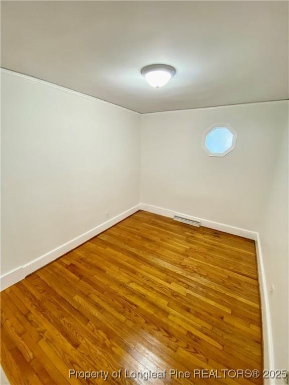 320 W 20th St, Lumberton, NC 28358 - empty room featuring wood finished floors and baseboards