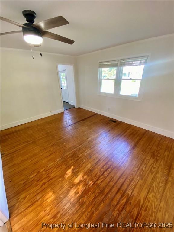 320 W 20th St, Lumberton, NC 28358 - unfurnished room featuring a ceiling fan and wood finished floors