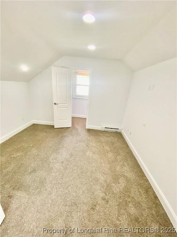 320 W 20th St, Lumberton, NC 28358 - additional living space featuring carpet floors, vaulted ceiling, and a baseboard heating unit