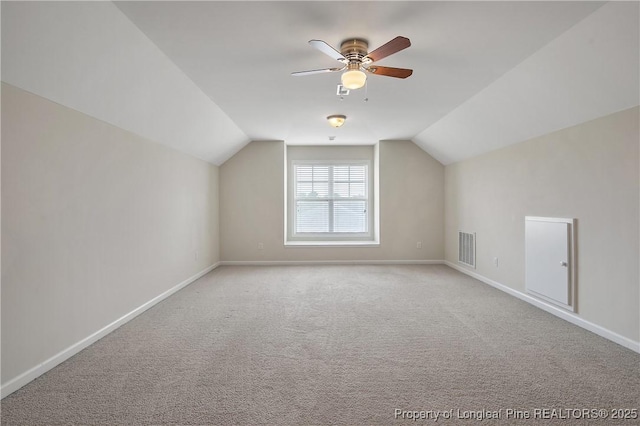 153 Dairy Ct, Raeford, NC 28376 - additional living space with vaulted ceiling, a ceiling fan, and carpet