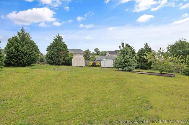 153 Dairy Ct, Raeford, NC 28376 - view of green lawn with a storage shed