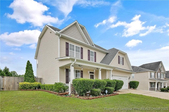 153 Dairy Ct, Raeford, NC 28376 - view of front of property with covered porch, driveway, and a garage