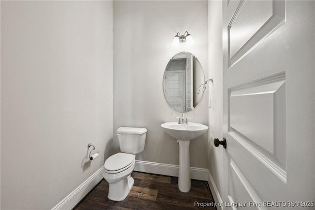 405 Gilpin Way, Cary, NC 27519 - half bath featuring wood finished floors, toilet, and baseboards