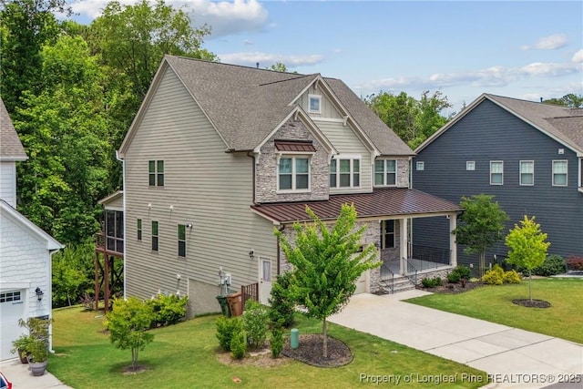 405 Gilpin Way, Cary, NC 27519 - craftsman house featuring a garage, driveway, covered porch, and a front lawn