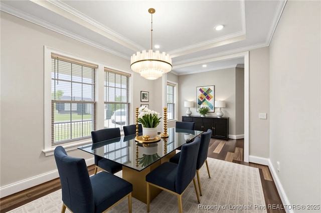 405 Gilpin Way, Cary, NC 27519 - dining room featuring wood finished floors, baseboards, crown molding, a raised ceiling, and recessed lighting