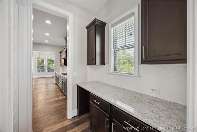 405 Gilpin Way, Cary, NC 27519 - bar area featuring dark wood-style flooring, tasteful backsplash, recessed lighting, baseboards, and stainless steel gas cooktop