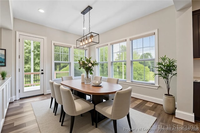 405 Gilpin Way, Cary, NC 27519 - dining area with light wood-type flooring, recessed lighting, baseboards, and a chandelier