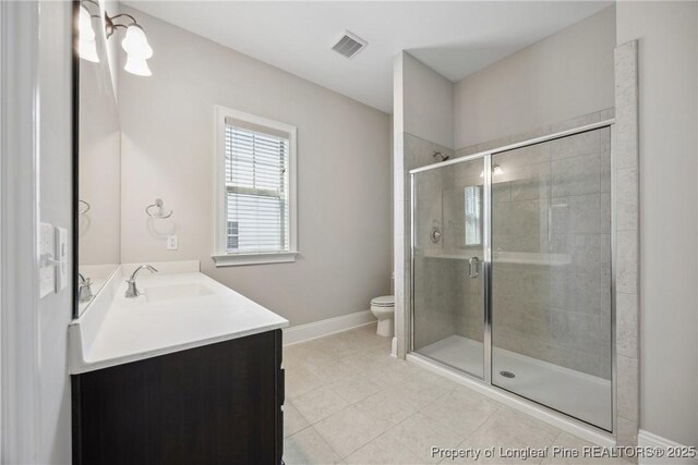 405 Gilpin Way, Cary, NC 27519 - bathroom featuring vanity, toilet, a shower stall, and baseboards