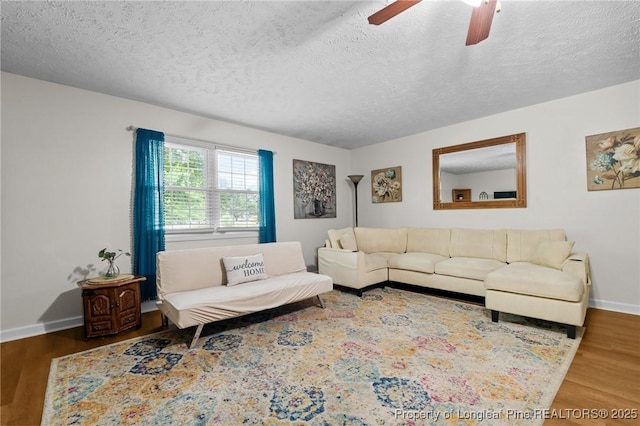 1963 Seabrook School Rd, Fayetteville, NC 28312 - living area with baseboards, a textured ceiling, wood finished floors, and ceiling fan