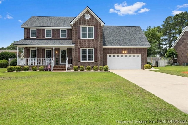 view of front of property featuring covered porch, an attached garage, driveway, brick siding, and a shingled roof