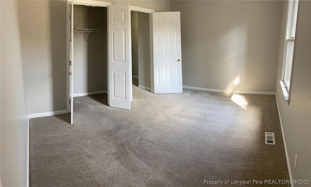 5566 Robmont Dr, Fayetteville, NC 28306 - unfurnished bedroom with carpet and a closet
