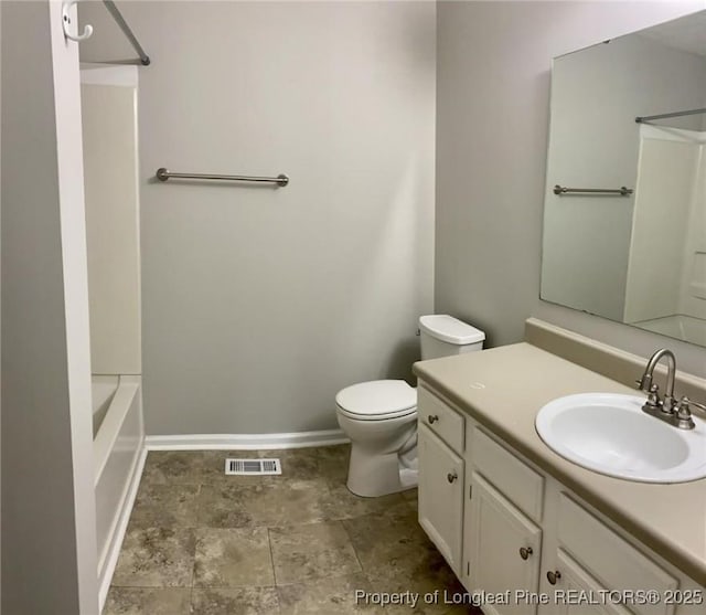 5566 Robmont Dr, Fayetteville, NC 28306 - bathroom featuring vanity, stone finish floors, and tub / shower combination